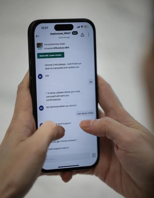 A smartphone displaying a conversation linked to a phishing scam on Carousell, as experienced by “Jane Lim” (not her real name), in Singapore.