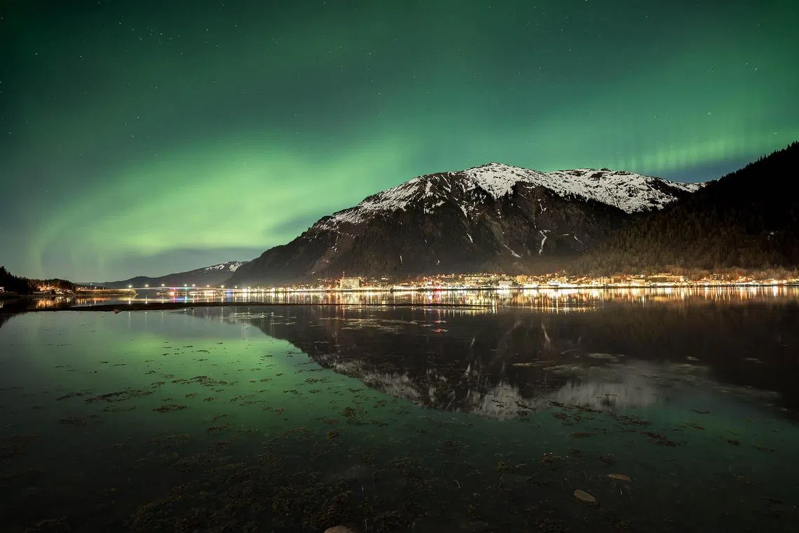 An image of the northern lights in Juneau, Alaska, shows what a camera with a longer exposure captures. 