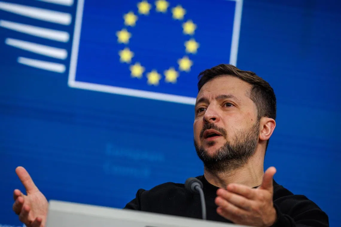 Ukrainian President Volodymyr Zelensky speaks during a press conference at the EU Summit in Brussels on Dec 19.
