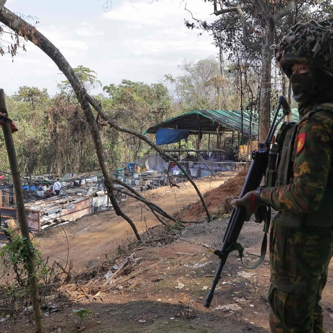 A Myanmar soldier guards a methamphetamine lab captured by the military near Namlan in Shan State on Jan 14.