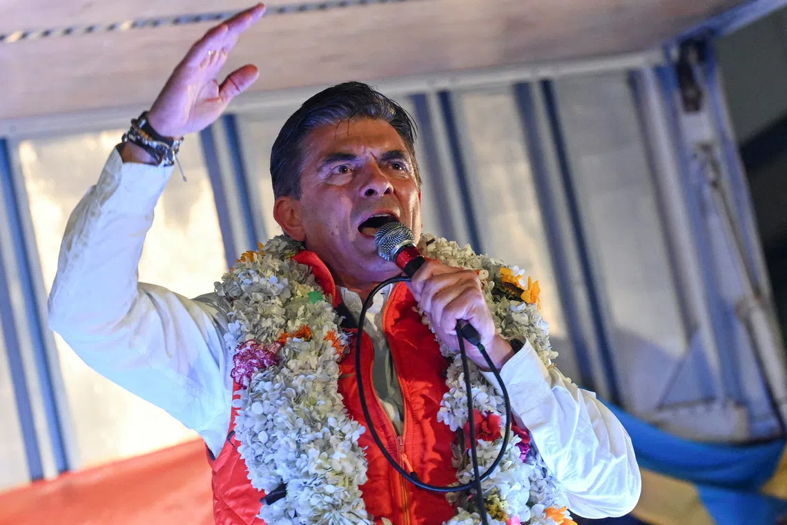 FILE PHOTO: Centrist senator and presidential candidate Rodrigo Paz of the Christian Democratic Party (PDC), speaks onstage during a celebration following preliminary results on the day of the presidential runoff election, in La Paz, Bolivia, October 19, 2025. REUTERS/Claudia Morales/File Photo