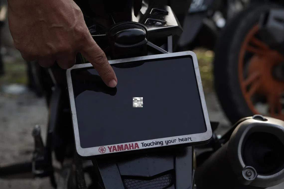 Malaysian police have fined a motorcyclist whose vehicle had a number plate the size of a finger.