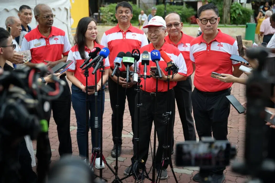 PSP chairman Tan Cheng Bock (centre) introducing (from left) Mr S. Nallakaruppan, Ms Wendy Low, Mr Harish Pillay, Mr A'bas Kasmani and Mr Lawrence Pek.