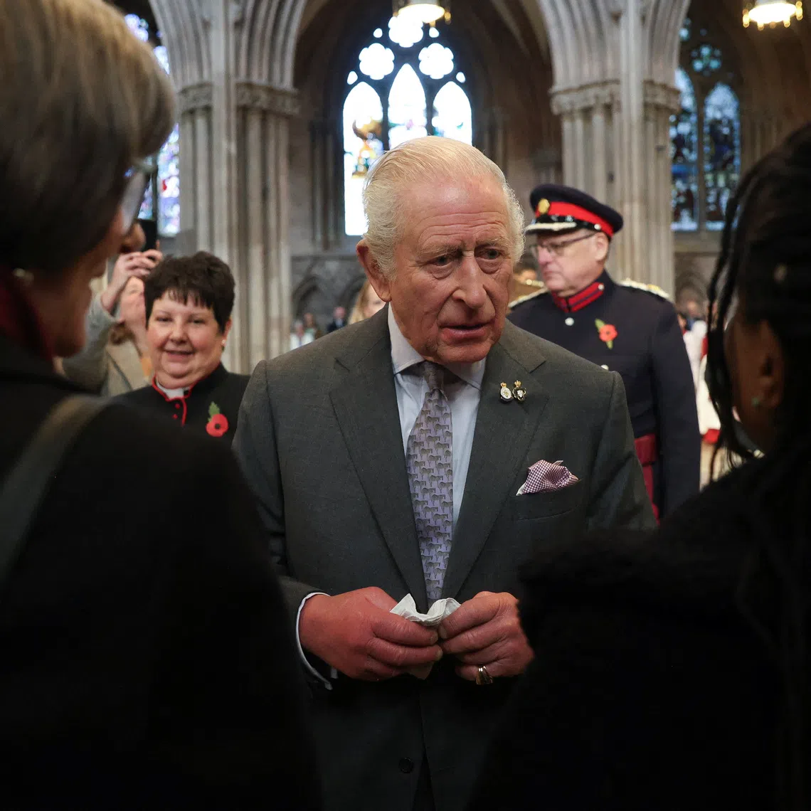 Britain’s King Charles looks on as he meets community groups during his visit at Lichfield Cathedral, with a focus on the Fenland Black Oak Table, The Table for the Nation, in Lichfield, Staffordshire, Britain October 27, 2025. REUTERS/Temilade Adelaja/Pool