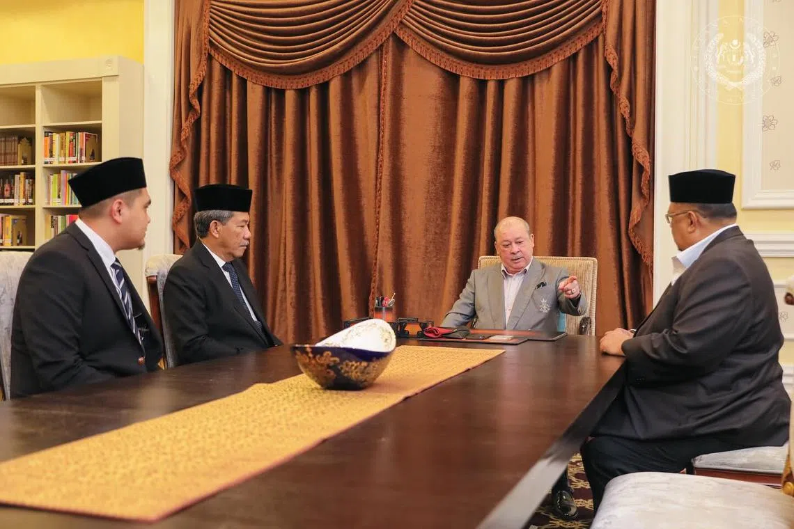 Malaysia's King, Sultan Ibrahim Iskandar (in grey), speaking to (from left) Dr Akmal Saleh, Foreign Minister Mohamed Hasan and Melaka's Umno chief Ab Rauf Yusoh. DAP deputy secretary-general Liew Chin Tong was also at the meeting on April 9.
