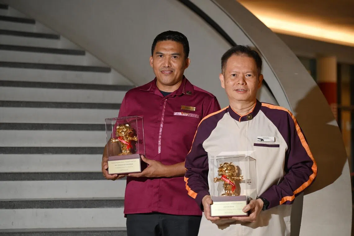 SMRT bus driver Yau Minddin Muhamad (left) and SBS Transit senior assistant interchange supervisor Lim Poh Boon won the Outstanding Award, a top honour given out at the annual Transport Gold Awards.