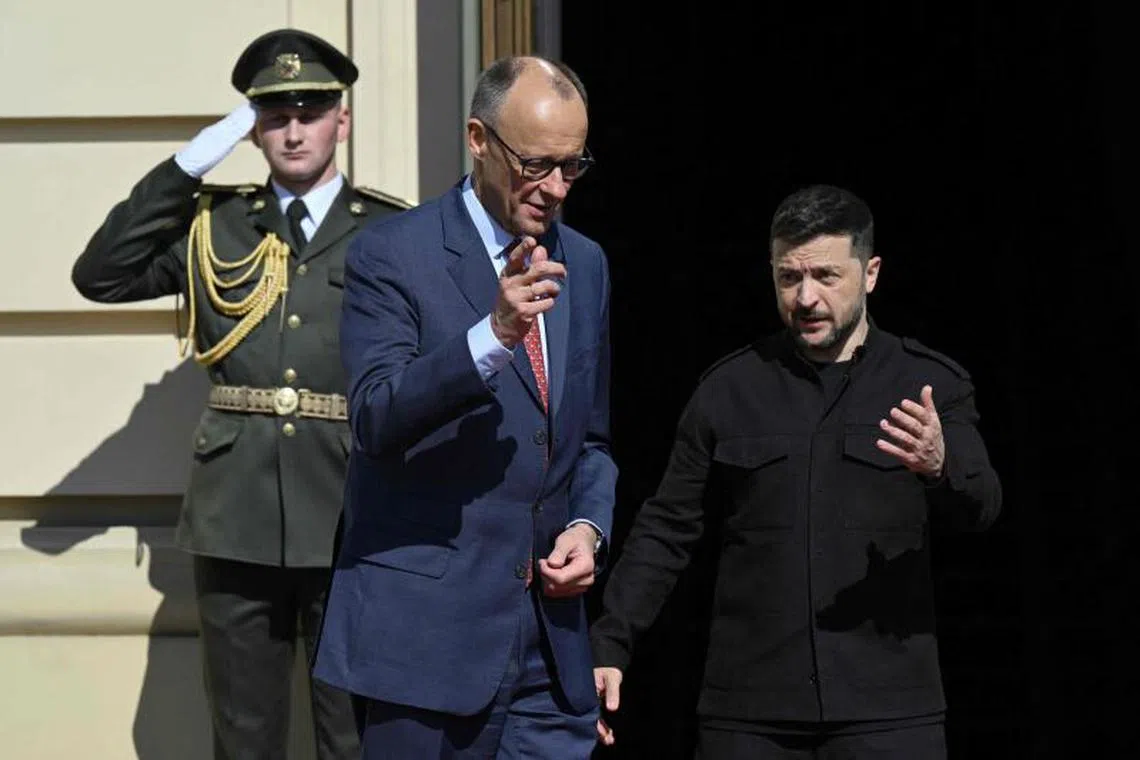 Ukraine's President Volodymyr Zelensky (right) and German Chancellor Friedrich Merz before a gathering of European leaders in the Ukrainian capital Kyiv on May 10.