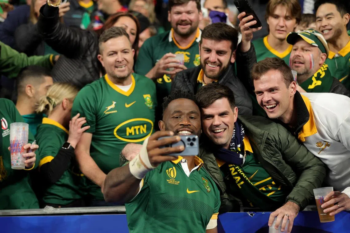 South Africa captain Siya Kolisi takes a welfie with supporters after the Rugby World Cup quarter-final win over hosts France.