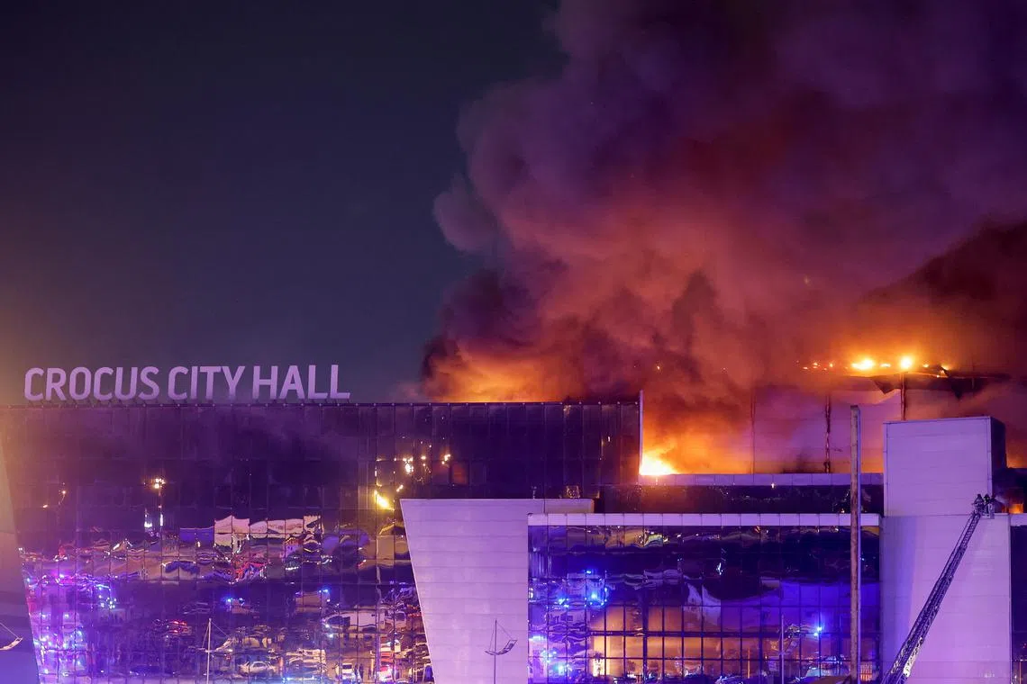 Smoke rises above the burning Crocus City Hall concert venue following a reported shooting incident, outside Moscow, Russia, on March 22.
