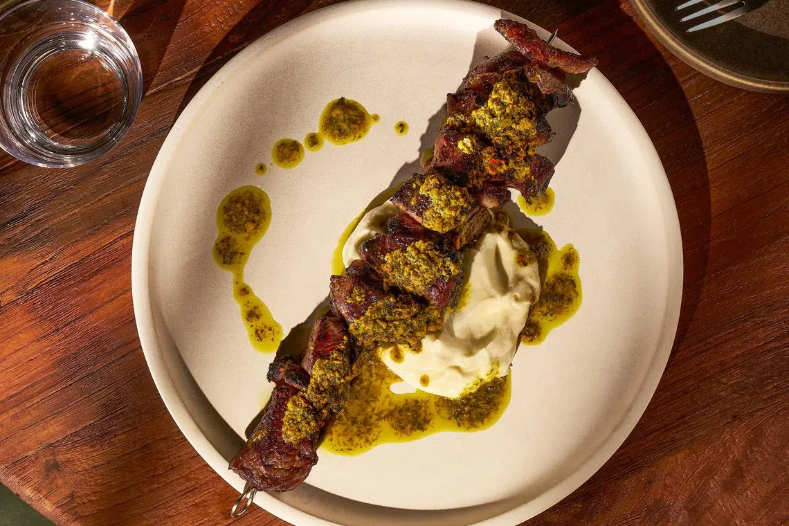 Grilled beef skewer with toum and chermoula from Magpie.