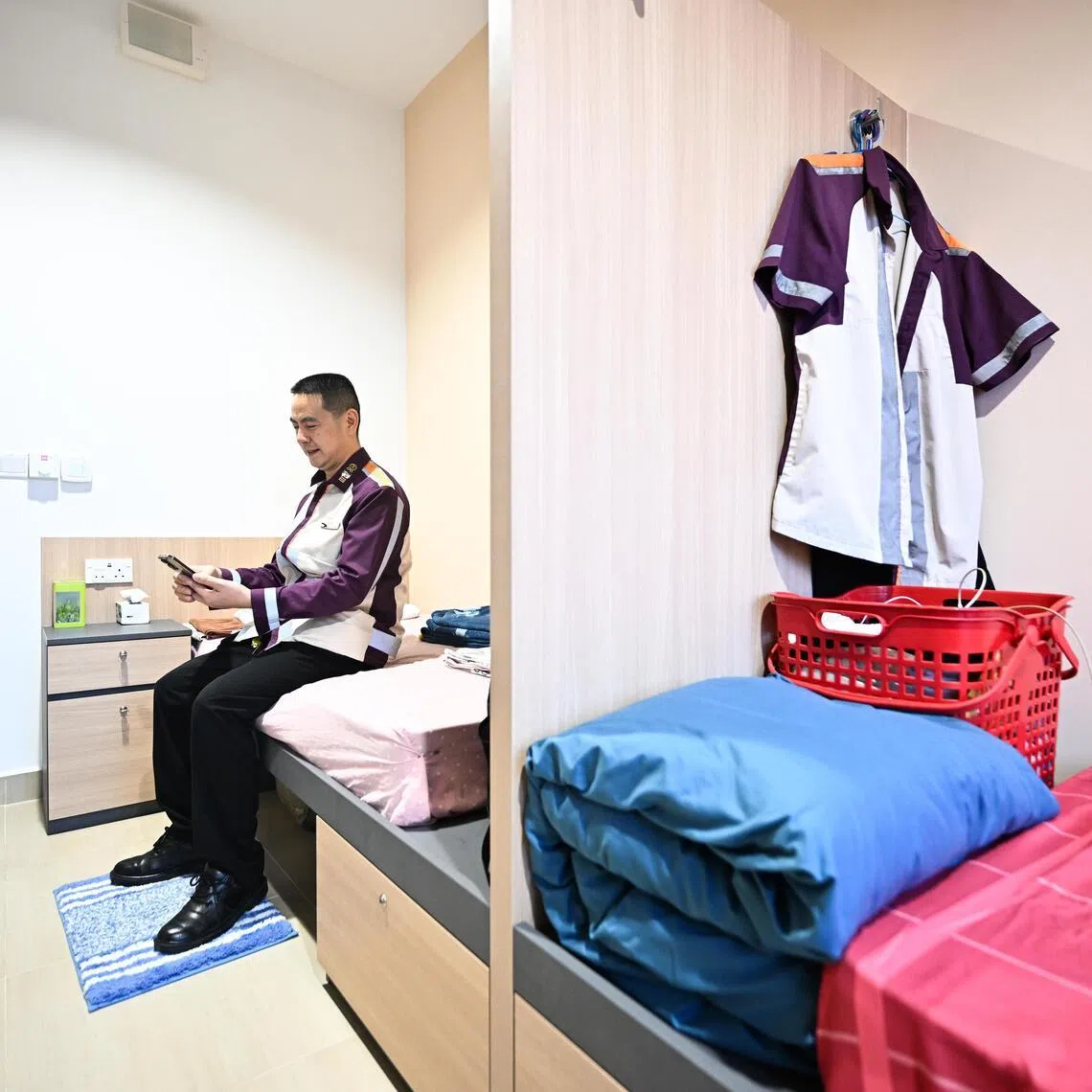 Senior bus captain Tian Yinfu inside the bedroom of his apartment at SBS Transit’s SQ@Sengkang West.