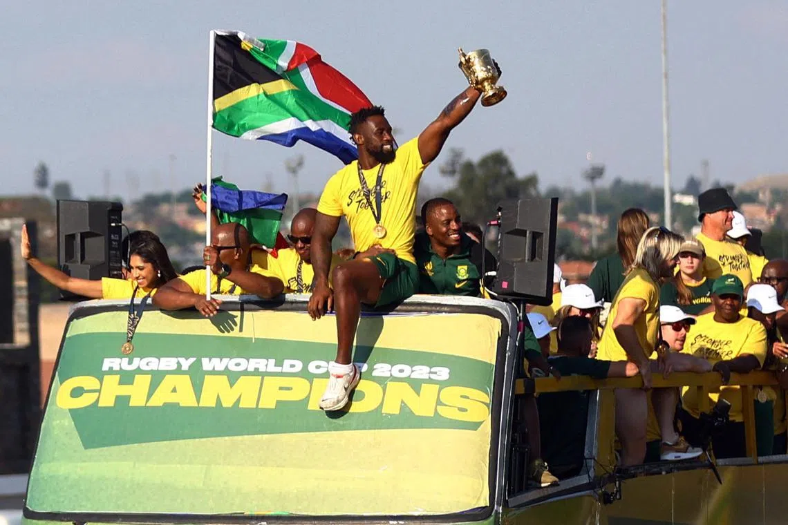 South Africa's inspirational rugby captain Siya Kolisi brandishes the World Cup during his team's victory tour.