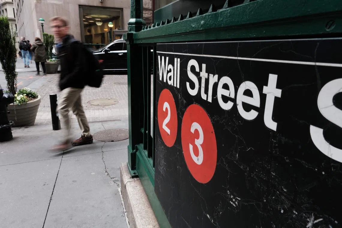 NEW YORK, NEW YORK - MAY 03: People walk along Wall Street outside of the New York Stock Exchange (NYSE) on May 03, 2023 in New York City. The Dow was slightly lower in morning trading as investors wait to see later today if the Federal Reserve will continue to raise interest rates.   Spencer Platt/Getty Images/AFP (Photo by SPENCER PLATT / GETTY IMAGES NORTH AMERICA / Getty Images via AFP)