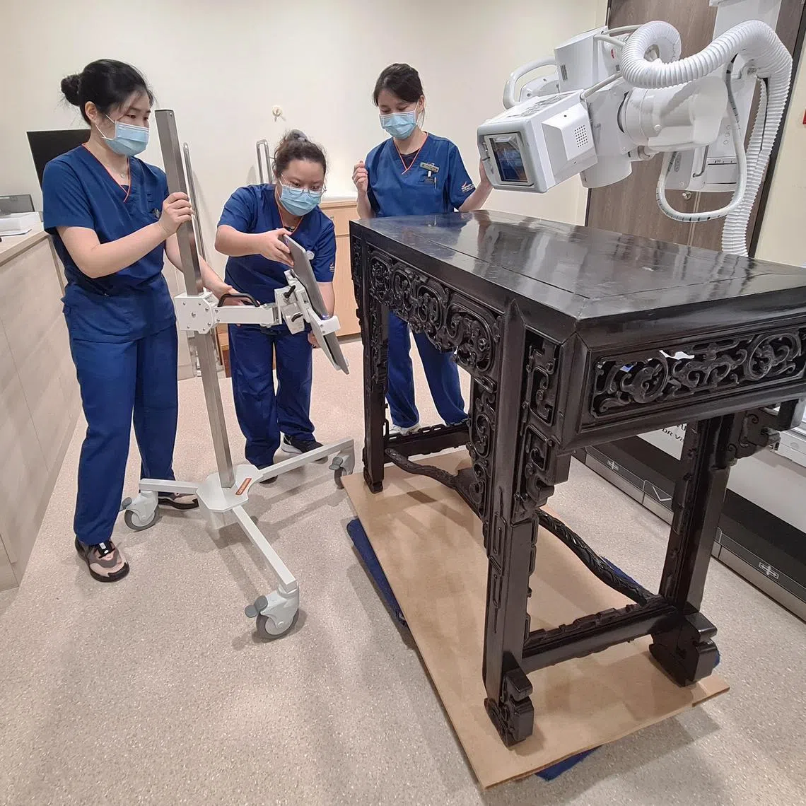 Sidetables from the ancestral home of Tan Kim Seng, Panglima Prang, are scanned using X-ray as part of research and conservation efforts at Singapore General Hospital in Singapore on 26 November 2022.