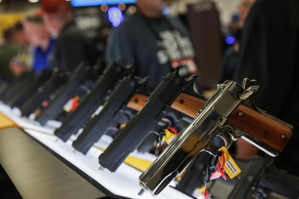 FILE PHOTO: Handguns are displayed in an exhibition booth during the annual National Rifle Association (NRA) meeting in Dallas, Texas, U.S., May 17, 2024.   REUTERS/Shelby Tauber/File Photo