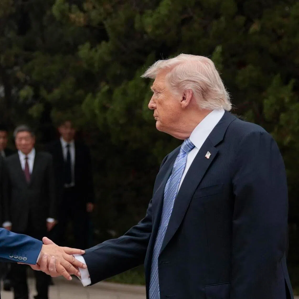 US President Donald Trump (R) shakes hands with China’s President Xi Jinping as he leaves after a visit to Zhongnanhai Garden in Beijing on May 15, 2026. (Photo by Evan Vucci / POOL / AFP)