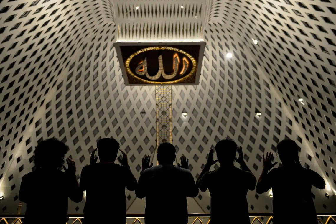 Indonesian Muslims offering the evening prayers called "Tarawih" at the Grand Mosque of Al Jabbar on the first night of holy fasting month of Ramadan in Bandung, West Java province, Indonesia, on Mar 11, 2024.