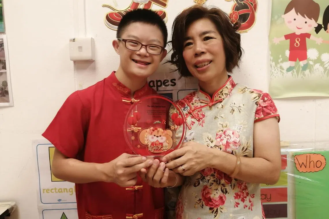 Madam Loh Yoke Lan (right) said her son Chee Hon (left), who has Down syndrome, has grown to become an independent young man.