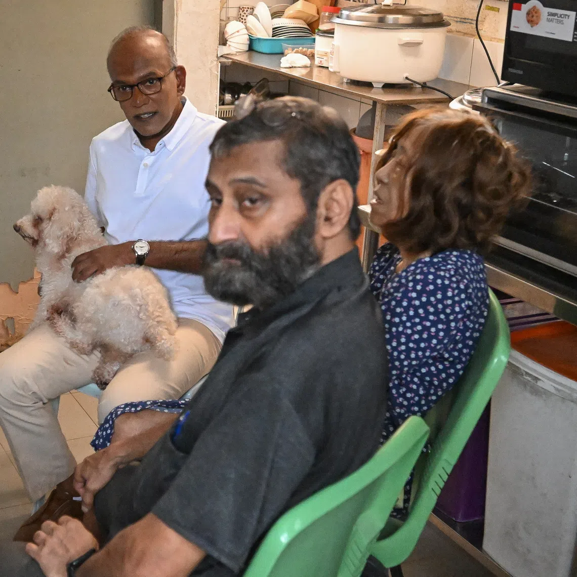 Animal Lovers League co-founders Mohan Div (in black shirt) and Cathy Strong with Minister for Home Affairs and Coordinating Minister for National Security K. Shanmugam on Dec 10.