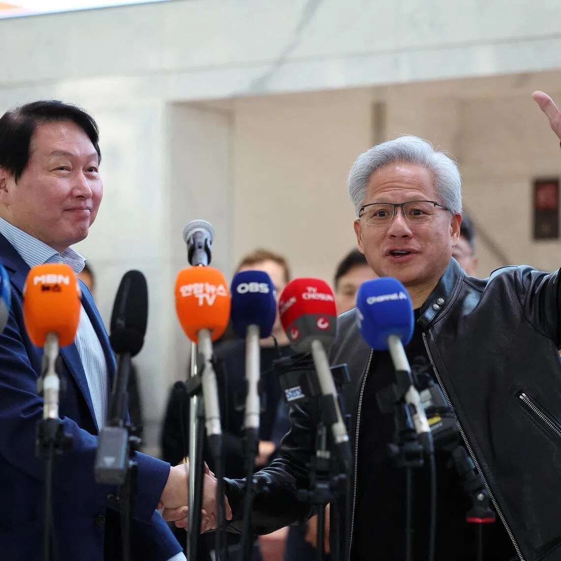 Nvidia CEO Jensen Huang and SK Group chairman Chey Tae-won at a media briefing on June 8.