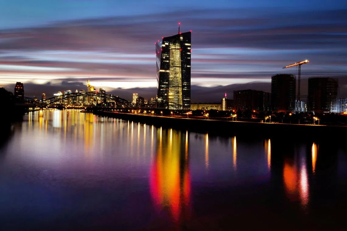 FILE PHOTO: The skyline with the banking district and the headquarters of the European Central Bank (ECB) are photographed in Frankfurt, Germany, October 4, 2021. REUTERS/Kai Pfaffenbach/File Photo