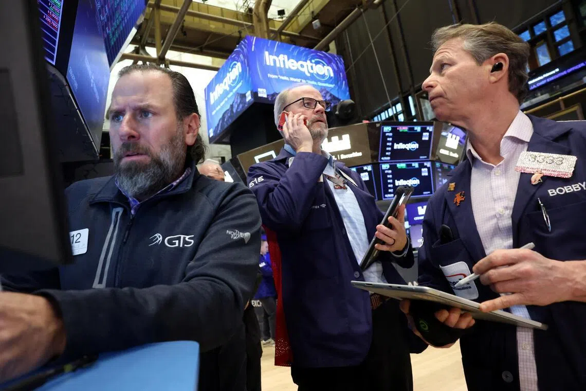 Traders working on the floor of the New York Stock Exchange, in New York City, on Feb 18.