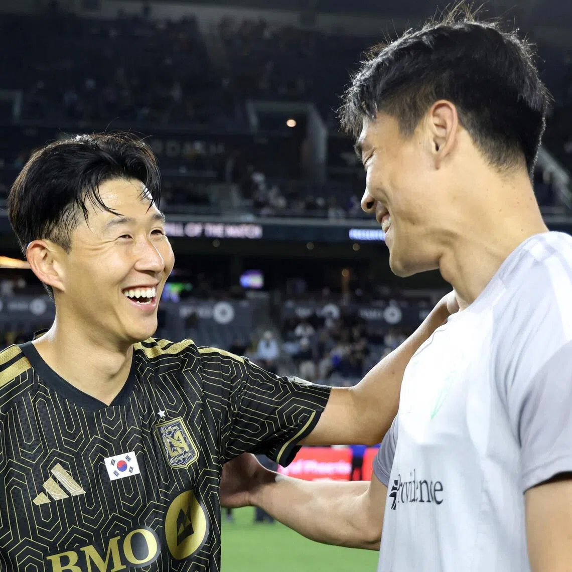 Los Angeles FC's Son Heung-min (left) chatting with fellow South Korean Kim Kee-hee of the Seattle Sounders after LAFC's 1-0 MLS win on May 24.