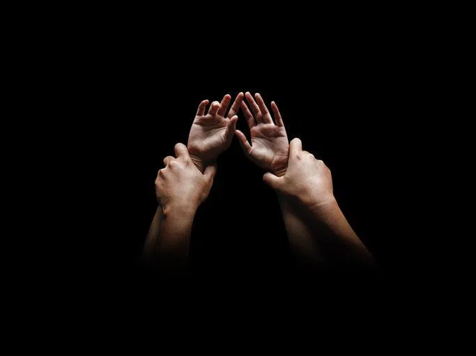 CMG1004 HengYY / Man hands holding a woman hands for rape and sexual abuse concept isolated on black background / iStock