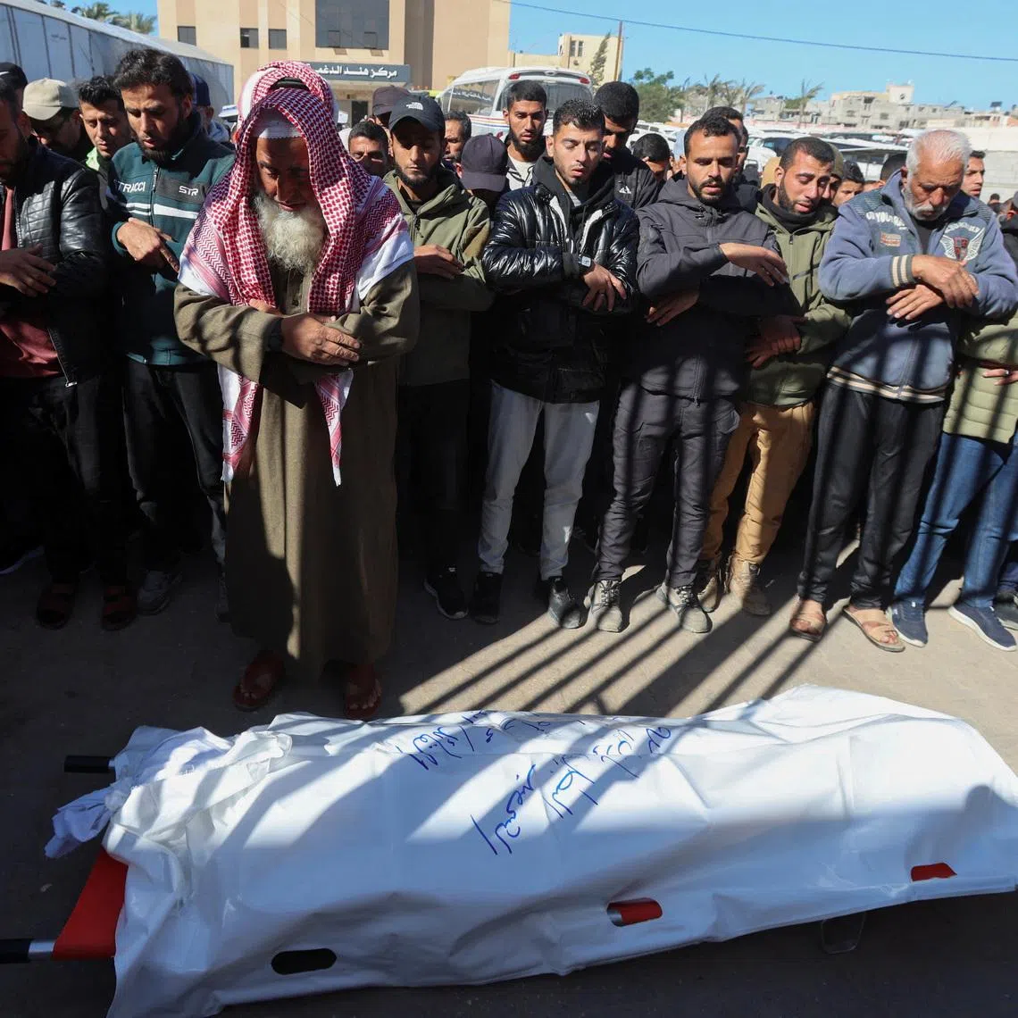 Mourners perform funeral prayers for senior Hamas police officer Mahmoud Al-Astal, who was killed on Monday, at Nasser Hospital in Khan Younis, southern Gaza Strip, January 12, 2026. REUTERS/Ramadan Abed