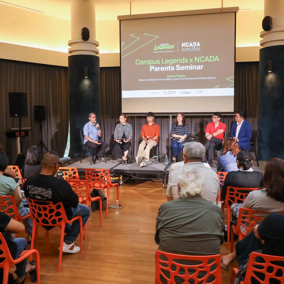 Minister of State for Home Affairs and National Development Muhammad Faishal Ibrahim (left) in a panel discussion at a seminar for parents on the harms of drug abuse on Aug 3.