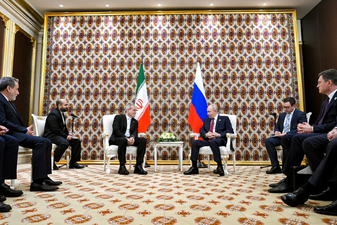 Russian President Vladimir Putin and Iranian President Masoud Pezeshkian attend a meeting in Ashgabat, Turkmenistan December 12, 2025. Sputnik/Kristina Kormilitsyna/Pool via REUTERS