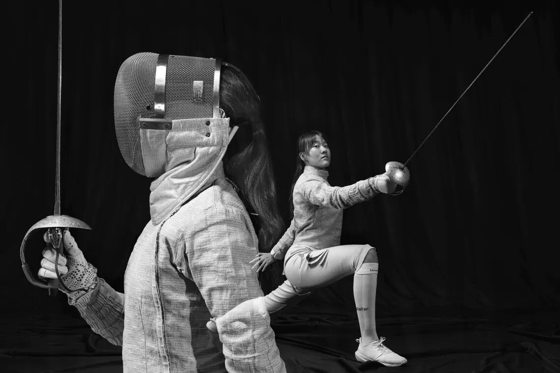 On one part of the guard (which separates the handle from the blade) of fencer Juliet Heng’s sabre, she’s written in Chinese: “None of my strikes are wasted.” Next to it, she’s scrawled a line in English: “I only see my goals, I don’t believe in failure.”