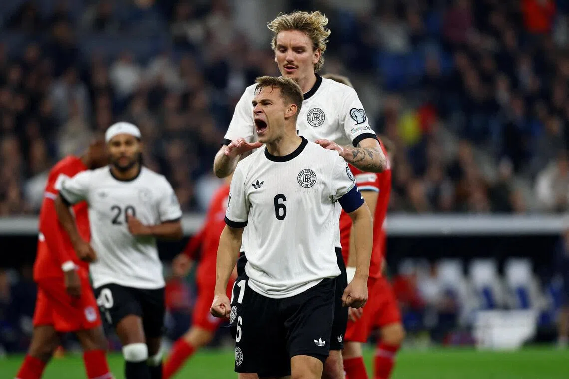 Germany's Joshua Kimmich celebrates scoring their second goal with Nick Woltemade.