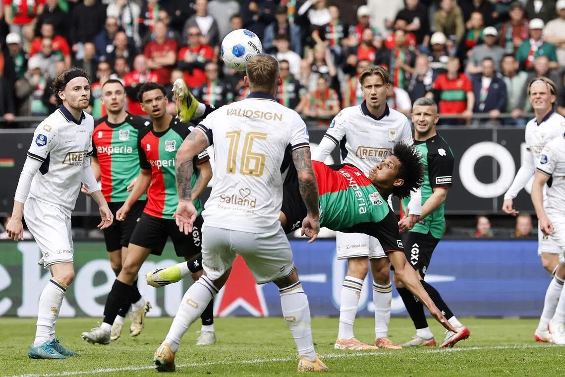 NEC Nijmegen's French midfielder Noe Lebreton scores a goal with an overhead kick in the Dutch Eredivisie football match against Go Ahead Eagles at Goffert stadium in Nijmegen on May 17, 2026.