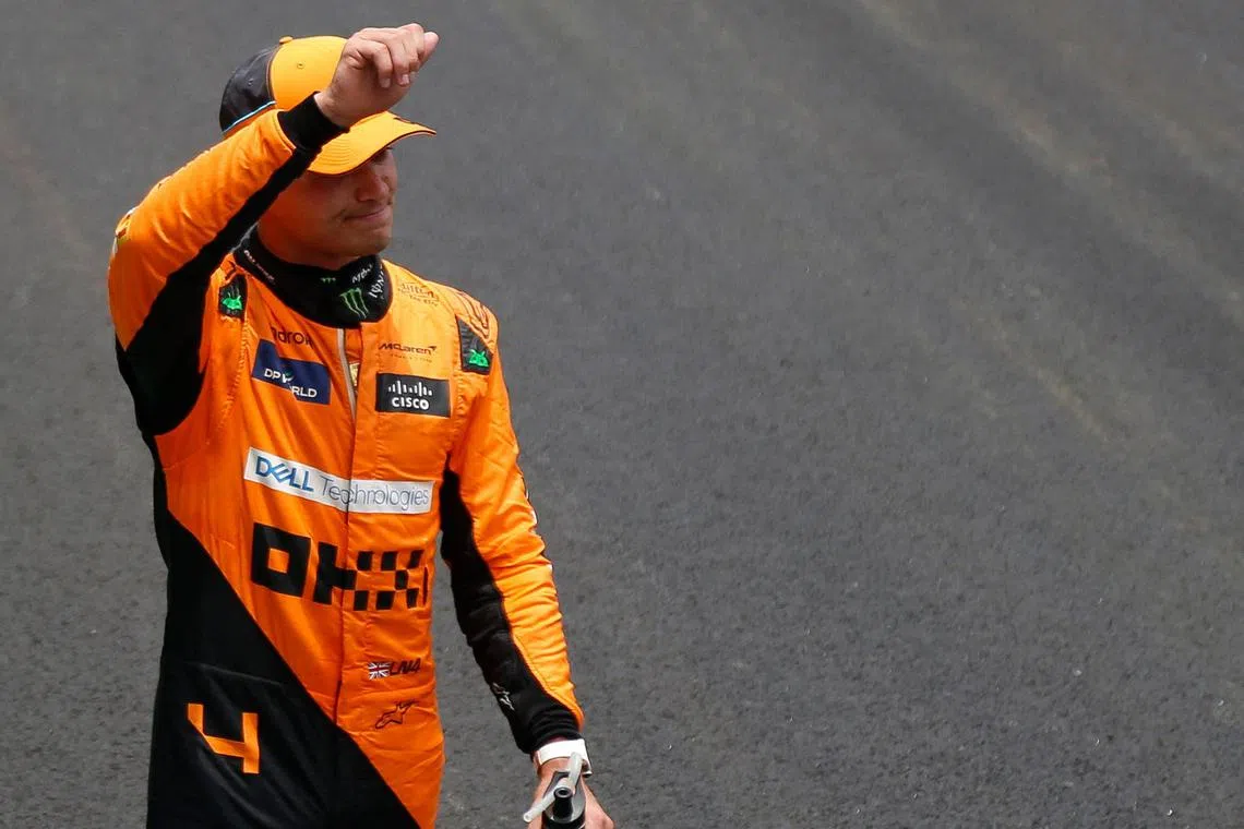 McLaren's Lando Norris waving to the crowd after winning the sprint race on Nov 2, ahead of the Brazilian grand prix.