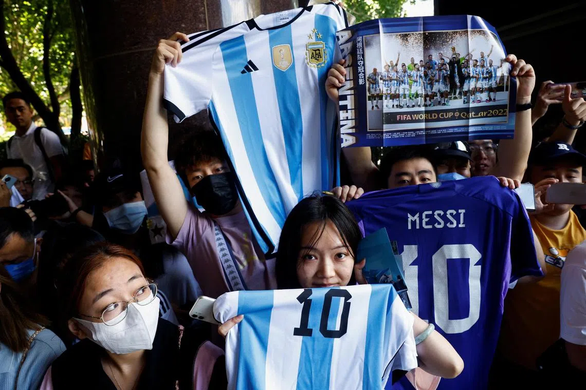 Chinese fans of Argentina’s Lionel Messi wait for his arrival at a hotel in Beijing on June 10, 2023.