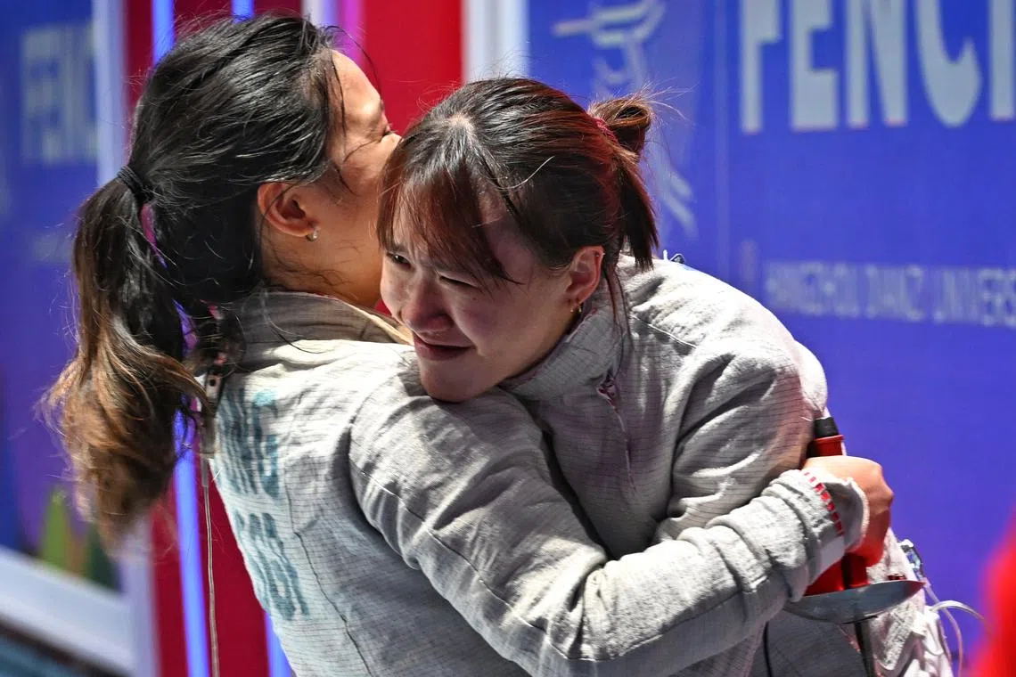 Singapore’s Juliet Heng (second from right) is being consoled by Jessica Ong after their Women’s Sabre Team quarterfinals loss in the 19th Asian Games Hangzhou 2022 on Sept 29.