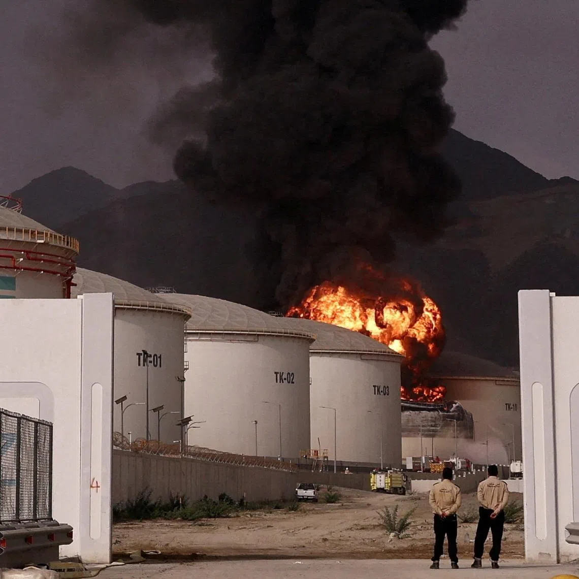 FILE PHOTO: Fire and smoke rise in the Fujairah oil industry zone, caused by debris after interception of a drone by air defenses, according to the Fujairah media office, amid the U.S.-Israel conflict with Iran, in Fujairah, United Arab Emirates, March 4, 2026. REUTERS/Amr Alfiky/File Photo