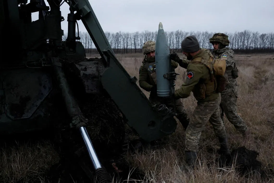 Ukrainian soldiers with the 43rd Heavy Artillery Brigade load a projectile to fire from a 2S7 Pion self-propelled cannon. 