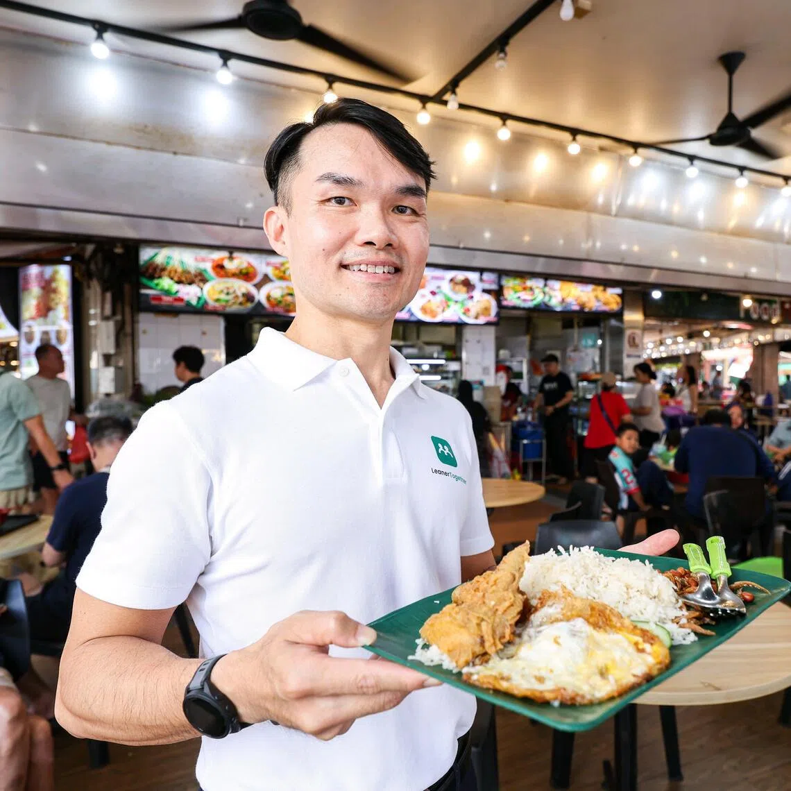 LeanerTogether founder Tan Chin Hock with his favourite nasi lemak at AR-Rina Nasi Padang in Bukit Batok.
