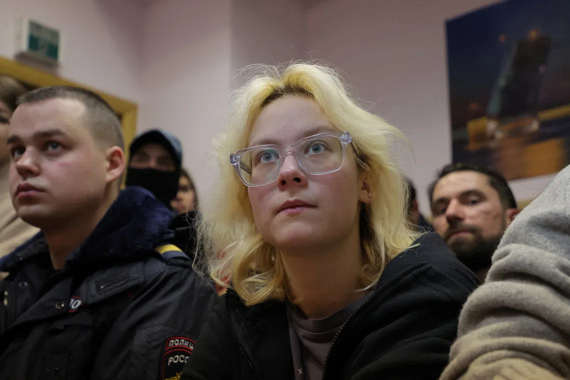 Diana Loginova, an 18-year-old street musician performing under the name Naoko, charged with discrediting Russia's armed forces, attends a court hearing in Saint Petersburg, Russia October 28, 2025. REUTERS/Anton Vaganov