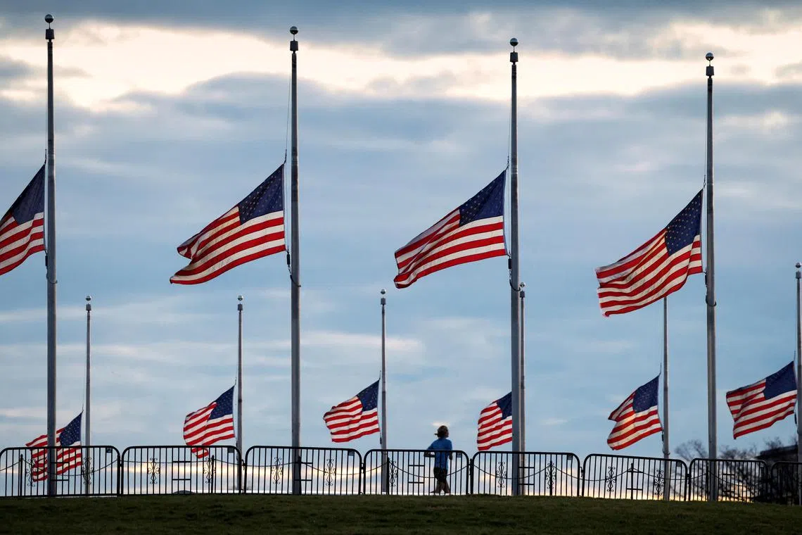 Flags flying at half-staff at the Washington Monument on the National Mall following the death of former US president Jimmy Carter, in Washington, on Dec 30.