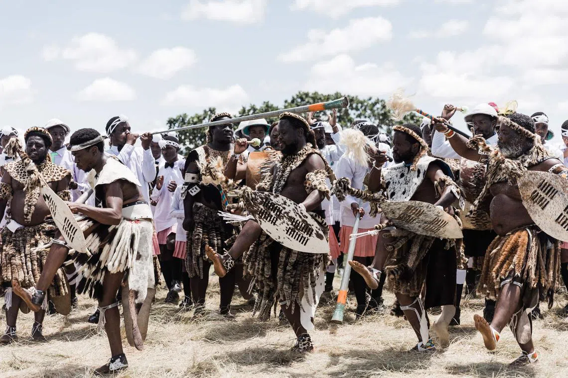 Followers of the Nazareth Baptist Church, from the Ekuphakameni group, also known as the Shembe Church, dressed in traditional attire, take part in a cultural dance on the Nhlangakazi Holy Mountain in Ndwedwe 85km north of Durban, on Jan 8, 2023. 