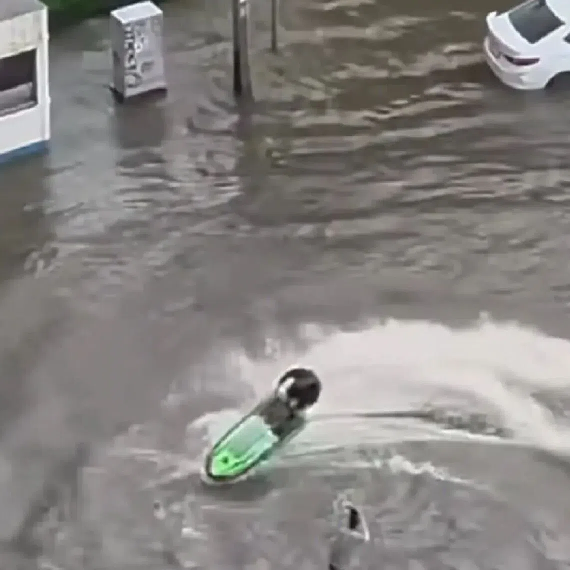 A widely circulated video showed the rider accelerating and making sharp turns, sending waves towards homes and roadside structures.