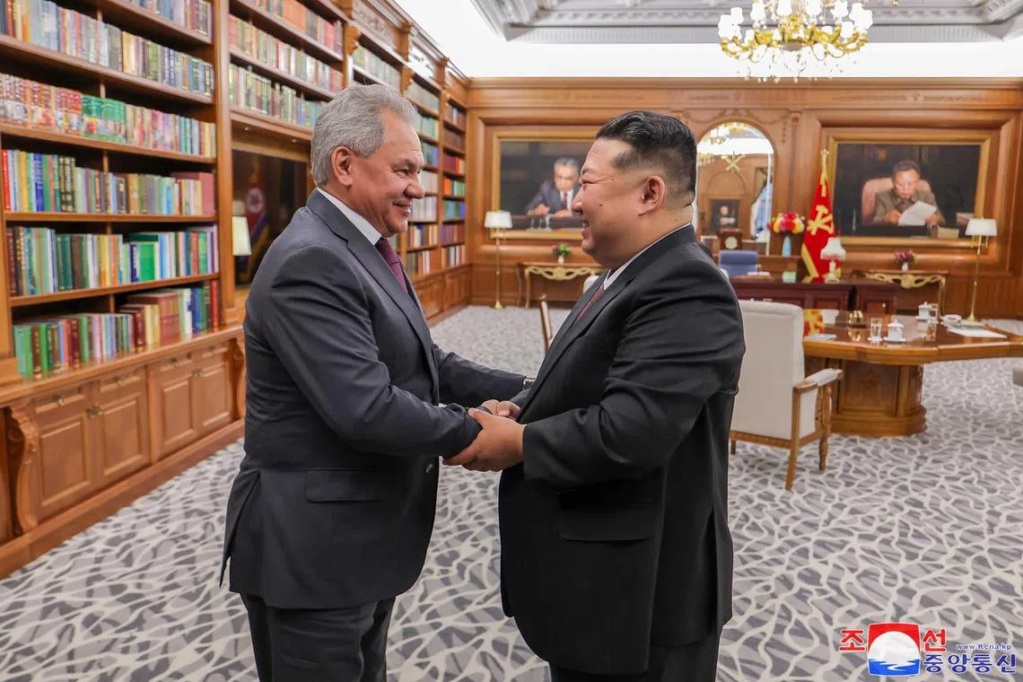 North Korean leader Kim Jong Un (right) shakes hands with Russia's Secretary of the Security Council Sergei Shoigu in Pyongyang, North Korea.