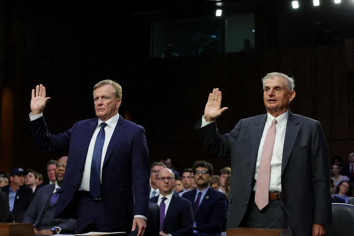 PGA Tour chief operating officer Ron Price and PGA Tour board member Jimmy Dunne are sworn in during the Senate hearing.