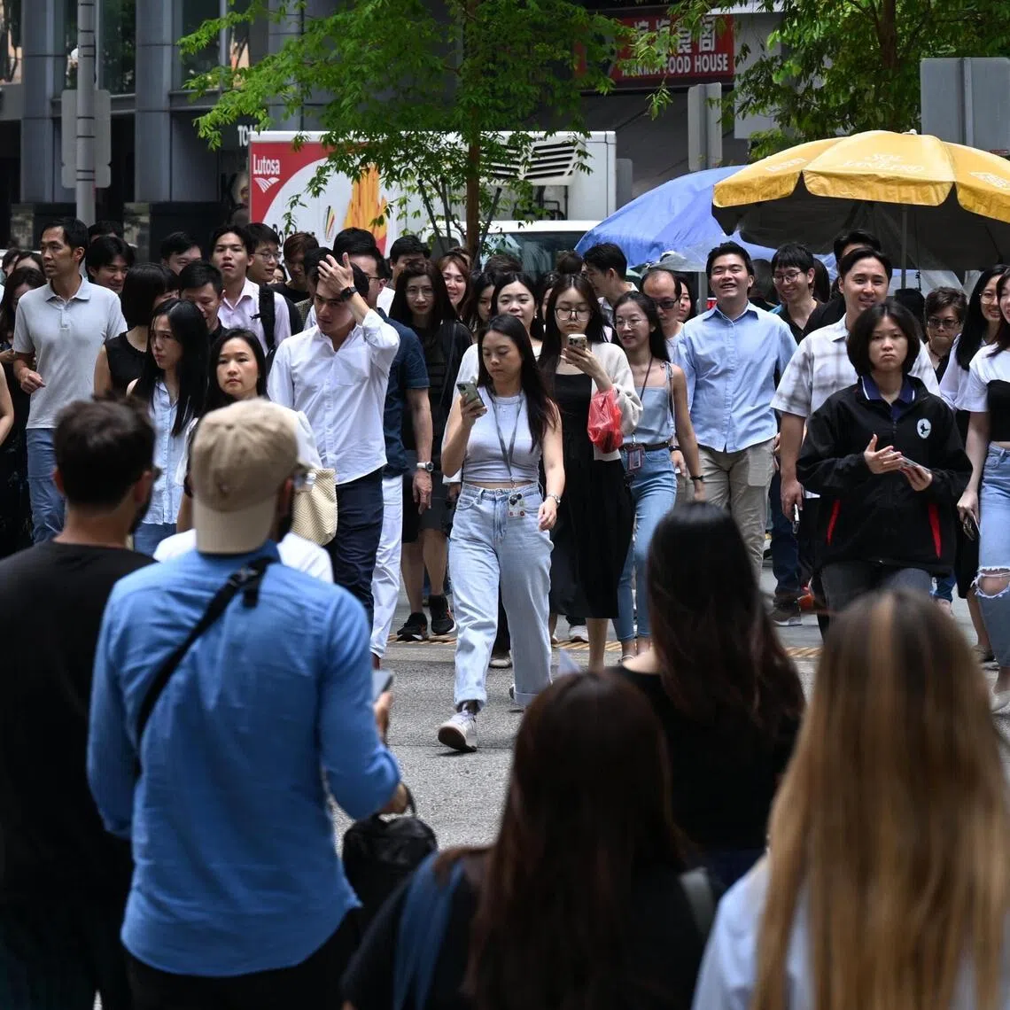 Generic photo of office workers at Raffles Place taken on Sept 26, 2025. Can be used for business, PMET, manpower, labour stories.