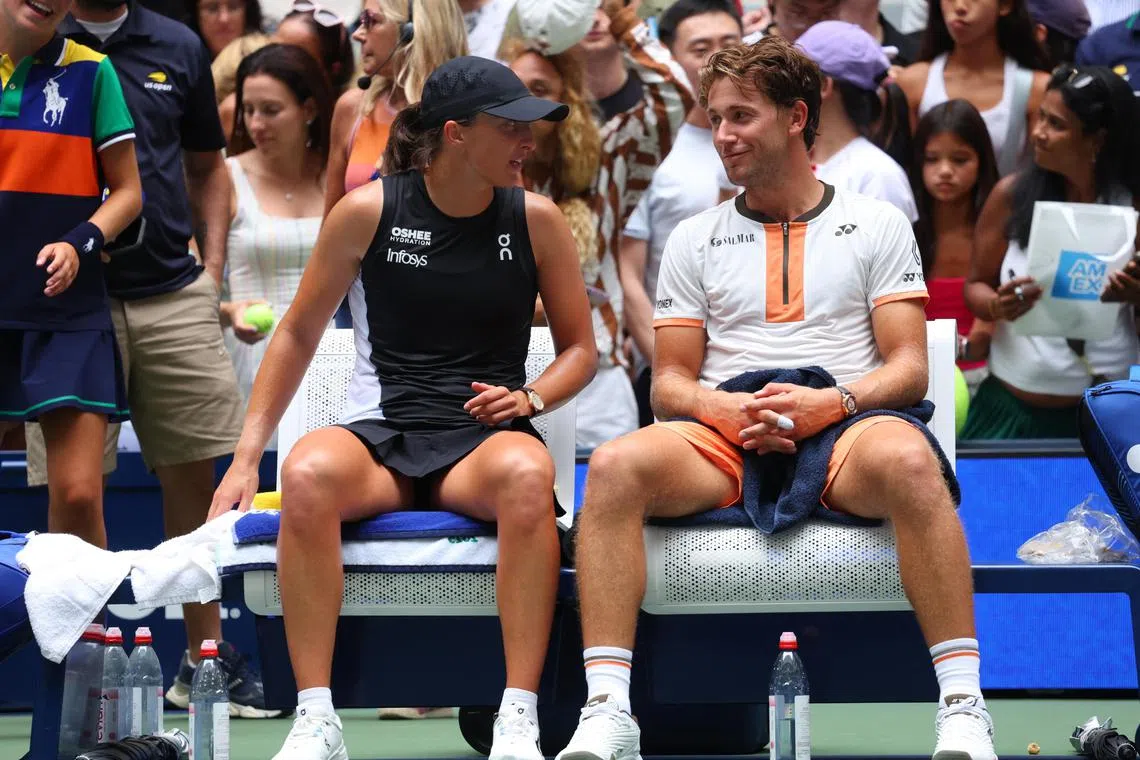 Poland's Iga Swiatek and Norway's Casper Ruud celebrate winning their US Open mixed doubles quarter-final match against Italy's Lorenzo Musetti and Caty McNally of the US.