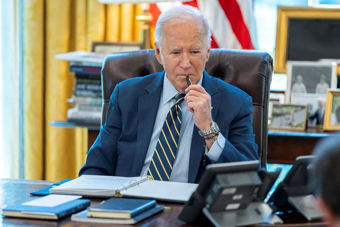 FILE PHOTO: U.S. President Joe Biden speaks on the phone with Israeli Prime Minister Benjamin Netanyahu in this White House handout image taken in the Oval Office in Washington, U.S., April 4, 2024. The White House/Handout via REUTERS/File Photo