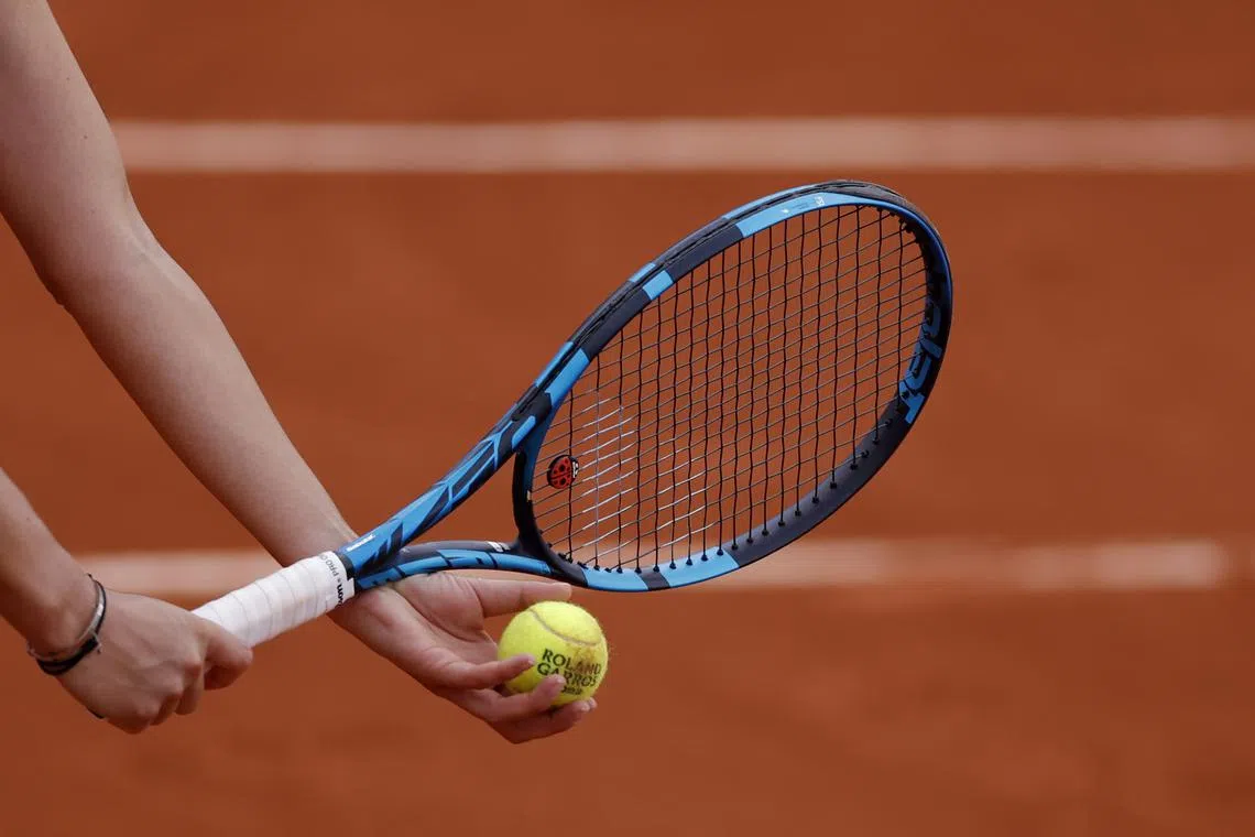 FILE PHOTO: Tennis - French Open - Roland Garros, Paris, France - May 30, 2022  General view of Romania's Irina-Camelia Begu holding a tennis ball and her racket during her fourth round match against Jessica Pegula of the U.S. REUTERS/Gonzalo Fuentes/File Photo